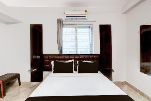 Ένα ή περισσότερα κρεβάτια σε δωμάτιο στο HOTEL O STAY INN RESIDENCY