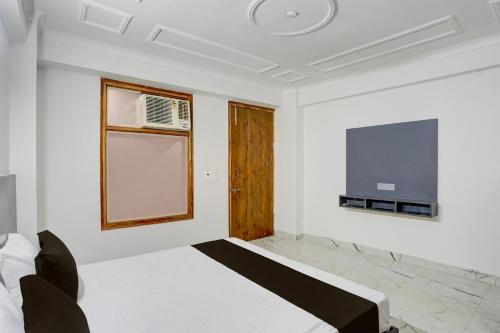 Postel nebo postele na pokoji v ubytování Hotel O Dk Hotel