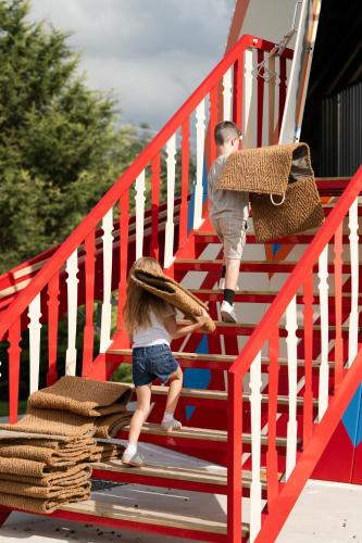a boy and a girl walking up the stairs at Roe Valley Resort in Limavady
