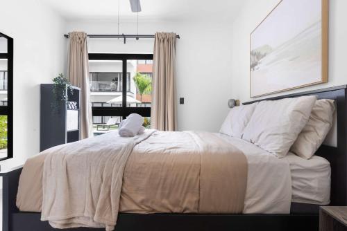 a bedroom with a bed with a blanket on it at NOK Perfect 1 BR by Vistacana Rentals in Punta Cana