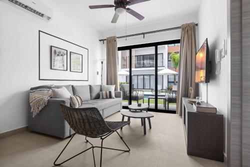 a living room with a couch and a table at NOK Perfect 1 BR by Vistacana Rentals in Punta Cana