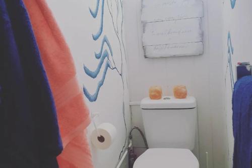 a bathroom with a toilet and a roll of toilet paper at 1 Bed Chalet - Sleeps 4 - Pets Parking Wifi in Sheerness