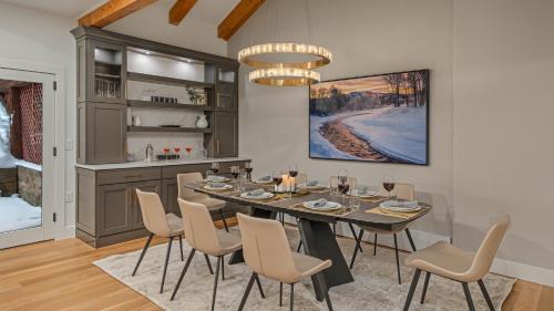 a dining room with a table and chairs at Watchtower Chalet in Steamboat Springs