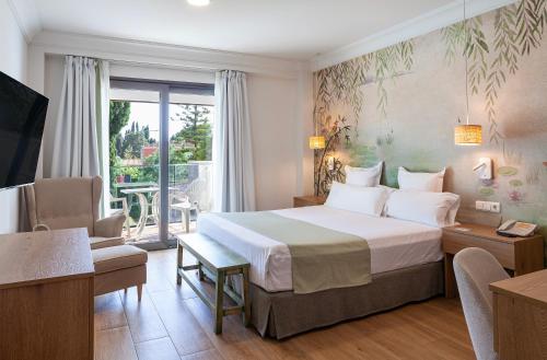 Postel nebo postele na pokoji v ubytování Hotel Jerez & Spa