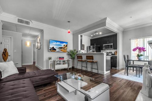 a living room with a couch and a table at Heart of La, Walk to everything!! in Los Angeles