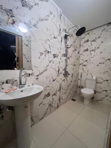a bathroom with a sink and a toilet at Cairo Casa Hostel in Cairo