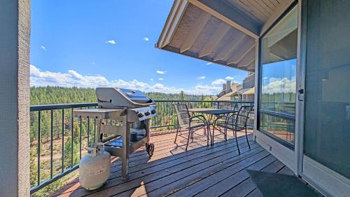 a grill on the deck of a house at River Ridge 423A condo in Bend