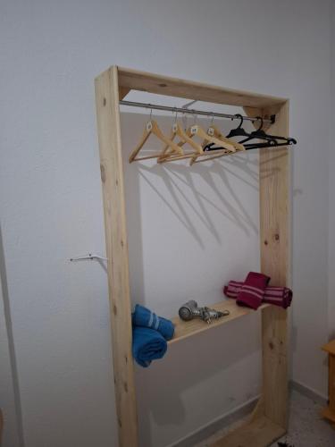 a wooden shelf with a bunch of tools on it at Dar Aziz VIP in Sousse