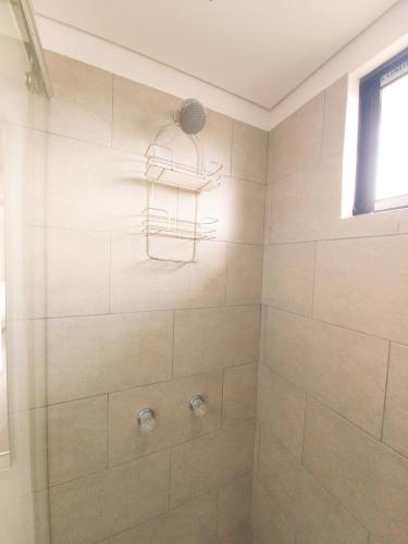 a bathroom with a shower with a glass door at Edificio Urban in Cajicá
