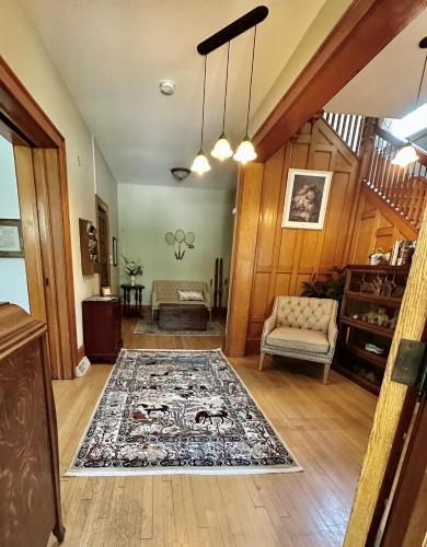 a living room with a rug on the floor at The Rest Is History in Baraboo