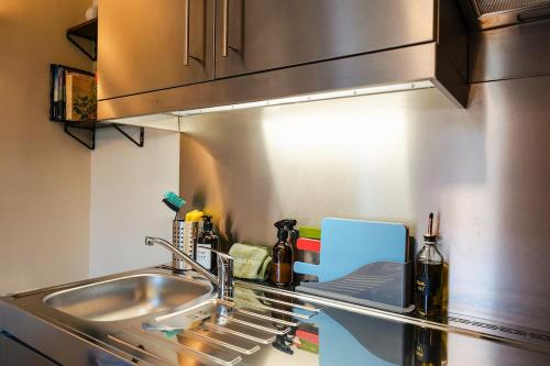 a kitchen with a sink and a counter top at Ashdown Forest Retreat in Nutley