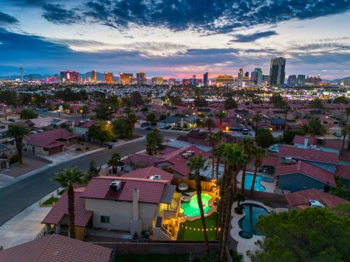 a view of a city at night with the city skyline at Strip-side Villa Pool, Mini Golf, Casino games in Las Vegas