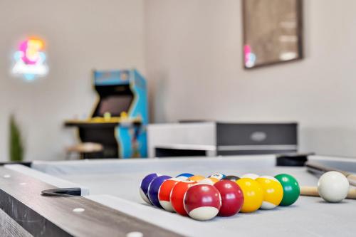 a table with billiard balls on top of it at Strip-side Villa Pool, Mini Golf, Casino games in Las Vegas