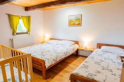Ένα ή περισσότερα κρεβάτια σε δωμάτιο στο Holiday Home Ico