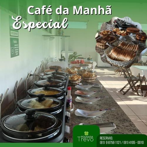 a buffet line with many plates of food on it at Hotel Trevo Caruaru in Caruaru