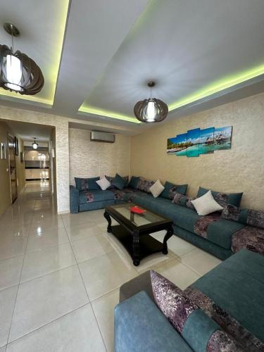 Χώρος καθιστικού στο Appartement Vue Piscine et Mer