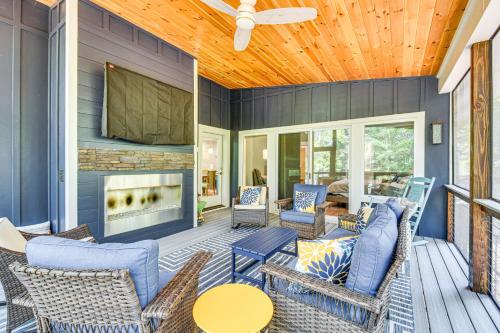a patio with chairs and a fireplace on a house at Waterfront Home on Lake Hartwell with Dock Access in Reed Creek
