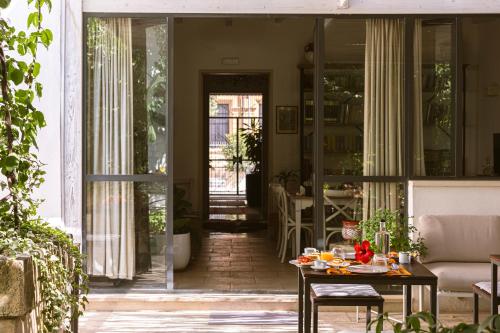 a living room with a table with food on it at B&B Don Alessandro in Surbo