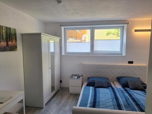 a bedroom with two beds and a window at Apartment in Beratzhausen in Beratzhausen