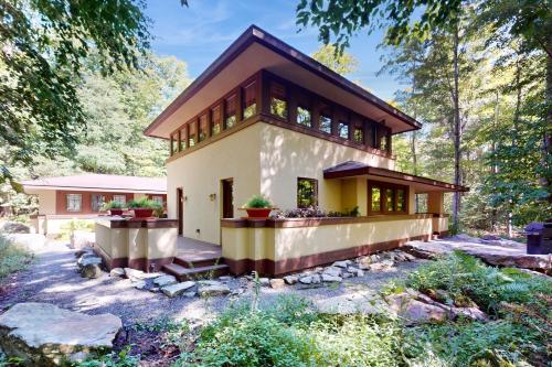 a house in the woods with at The Frank Lloyd Wright Home @ Deep Creek, MD in Bittinger