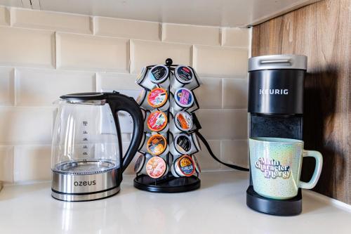 a coffee maker and a coffee pot on a counter at Modern-Chic Loft in Heart of Dallas in Dallas
