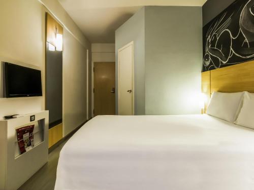 Postel nebo postele na pokoji v ubytování ibis Uberaba
