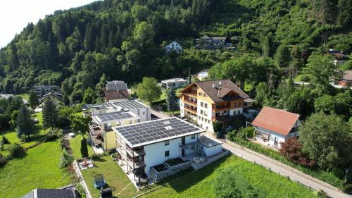 an aerial view of a house in the mountains at Familienhotel Steindl in Millstatt