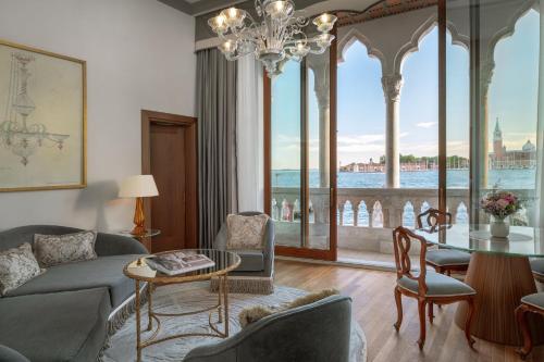 a living room with a couch and a table at Hotel Gabrielli Venezia - Starhotels Collezione in Venice