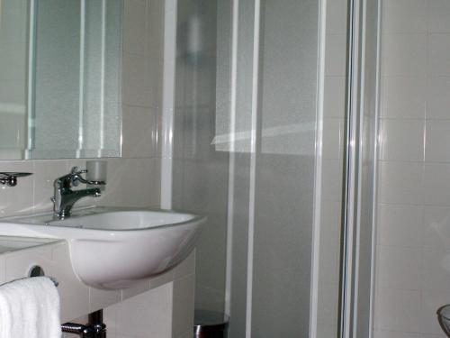 a bathroom with a sink and a shower at Cà Del Moro Resort & SPA in Pontremoli