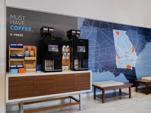 a coffee shop with a map on the wall at Holiday Inn Express & Suites Augusta West - Ft Gordon Area by IHG in Augusta