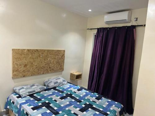 Postel nebo postele na pokoji v ubytování Dakar Yoff virage