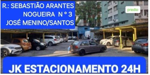 a picture of a parking lot with cars parked at Apartamento confortável José menino in Santos