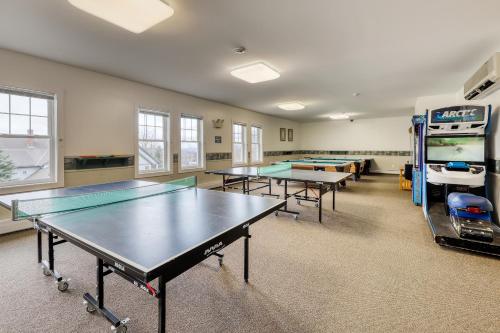 a ping pong room with ping pong tables in it at Falcons Unit #11 in Jeffersonville