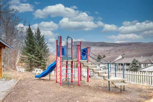 a playground with a slide in a yard at Falcons Unit #11 in Jeffersonville