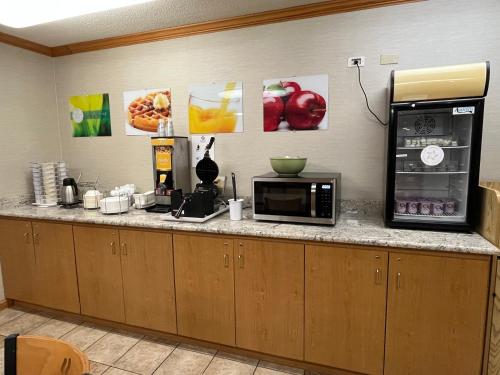 a counter with a microwave and a coffee maker at Quality Inn Arena in Wilkes-Barre