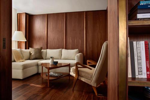 a living room with a couch and a table at Nautilus Sonesta Miami Beach in Miami Beach