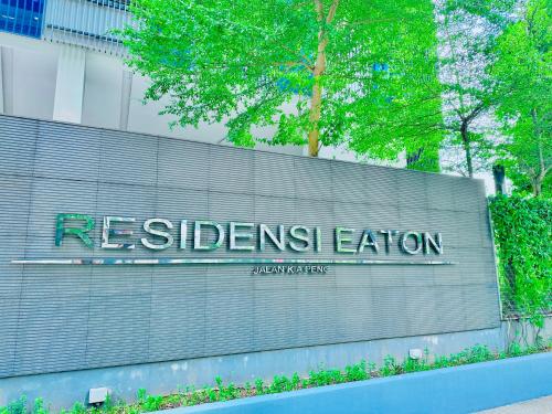 a retaining wall with the sign for the relaxation station at Eaton Suites KL By Luna in Kuala Lumpur