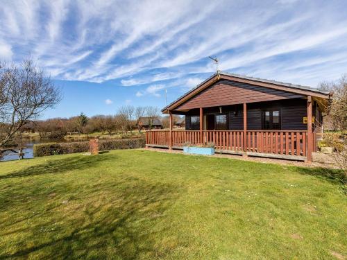 a large wooden house with a large yard with a house at 3 Bed in Clovelly 00372 in Clovelly