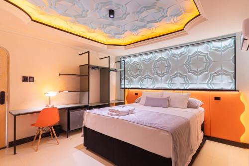 a bedroom with a bed and a window with a ceiling at Casa Stella Rooms in Cartagena de Indias