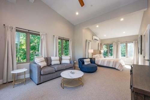 a living room with a couch and a bed at Blue Anchor in Swanton