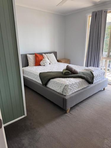 a bedroom with a bed in a room at Entire home near South West Rocks Beautiful Views in Pelican Island