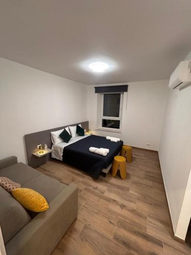 Кровать или кровати в номере Mondeo B&B