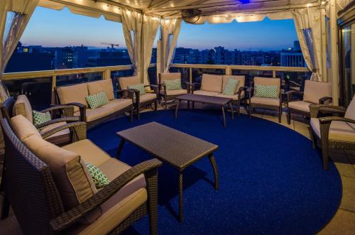a balcony on a cruise ship with chairs and tables at Beacon Hotel & Corporate Quarters in Washington