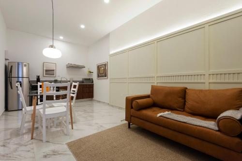 a living room with a couch and a table at Allan Poe 343 by Wynwood House in Mexico City
