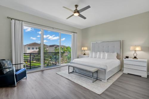 a bedroom with a bed and a large window at The Bear's Den Resort Orlando in Kissimmee