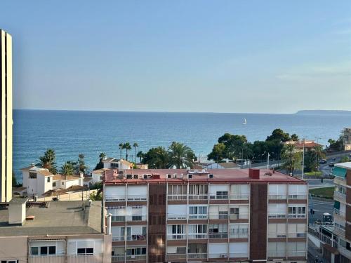 an aerial view of a building and the ocean at Delmar Apartment in Alicante