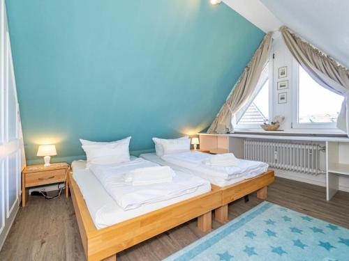 Un pat sau paturi într-o cameră la Holiday apartment with 2 bedrooms