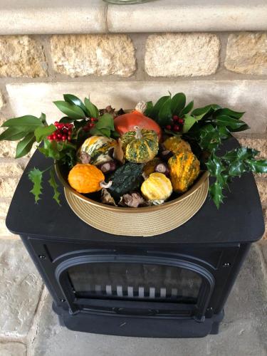 a bowl of vegetables sitting on top of a table at Cornerways B&B in Chipping Campden