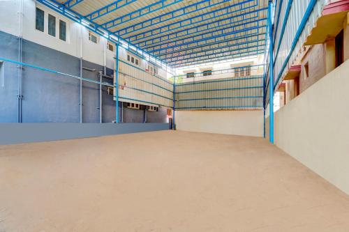 a large room with a large floor in a building at Super Hotel O Madurai Near Bus Stand in Madurai