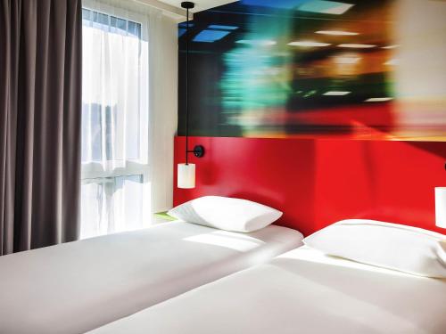 Ένα ή περισσότερα κρεβάτια σε δωμάτιο στο Ibis Styles Mulhouse Centre Gare